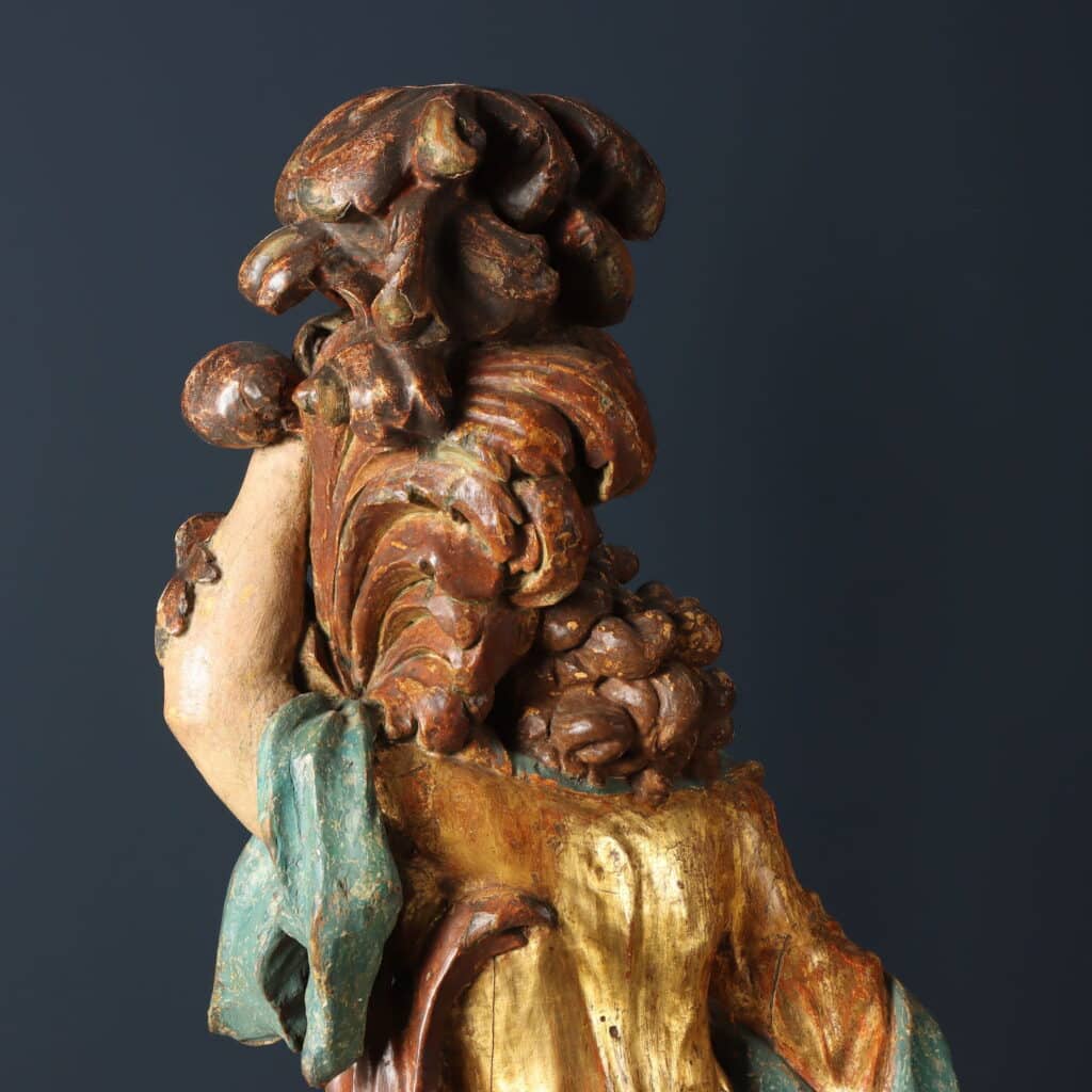 Coppia di figure con cornucopia Legno di tiglio intagliato dipinto e dorato