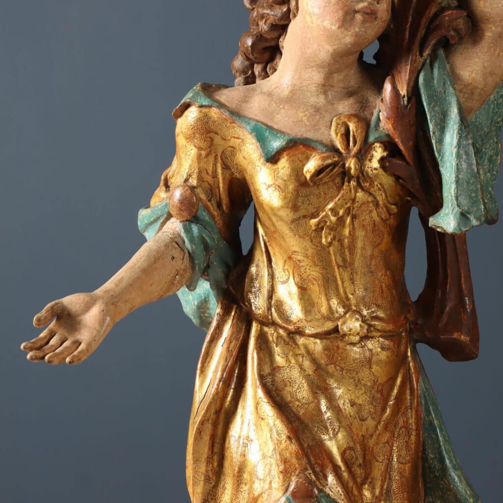 Coppia di figure con cornucopia Legno di tiglio intagliato dipinto e dorato