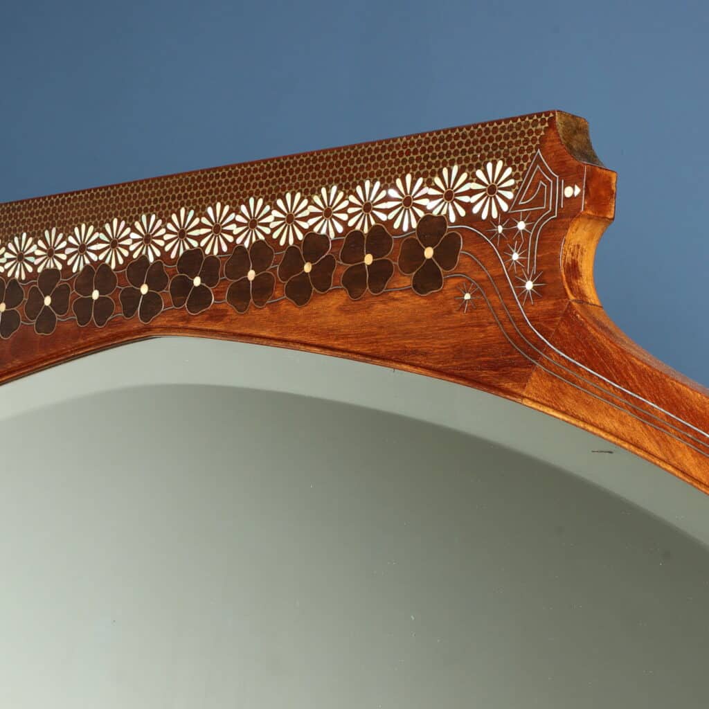Elegant mahogany sofa with brass stringing and mother-of-pearl decoration.