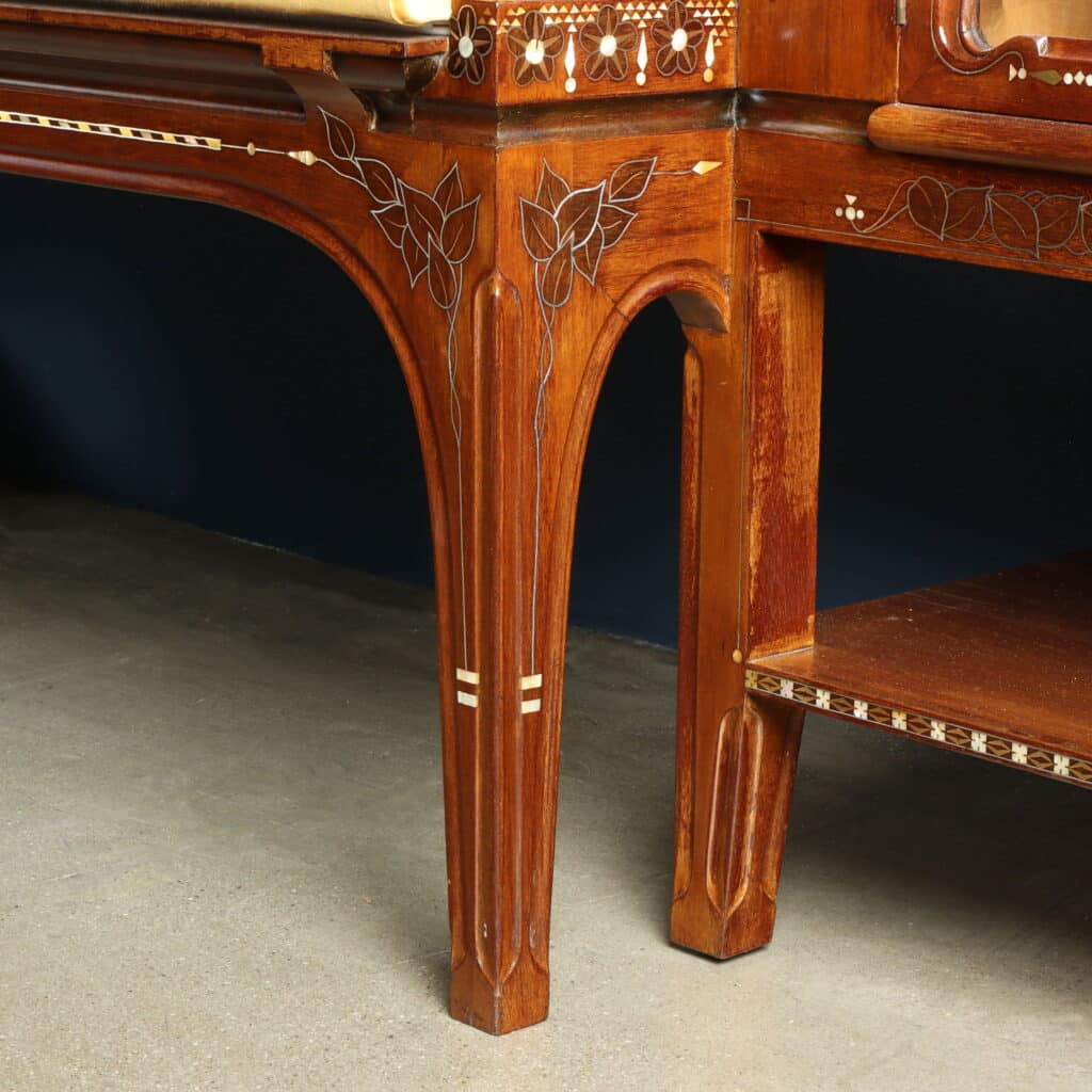 Elegant mahogany sofa with brass stringing and mother-of-pearl decoration.