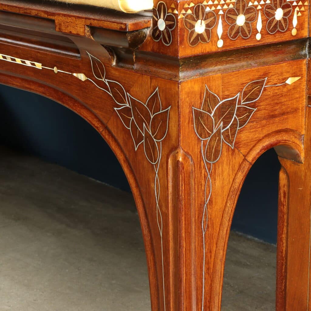Elegant mahogany sofa with brass stringing and mother-of-pearl decoration.