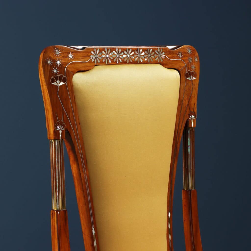 Mahogany writing desk enriched with brass stringing and floral marquetry.