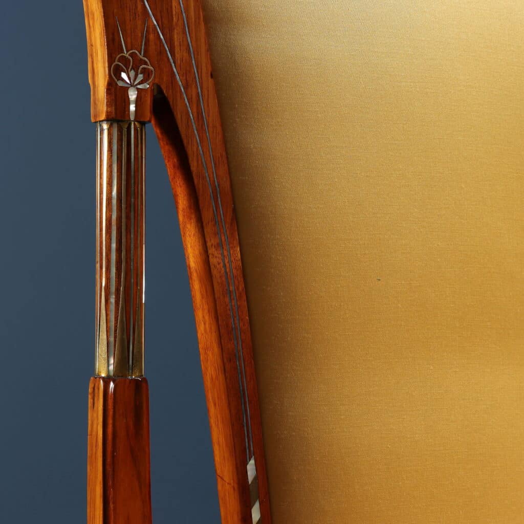 Mahogany writing desk enriched with brass stringing and floral marquetry.