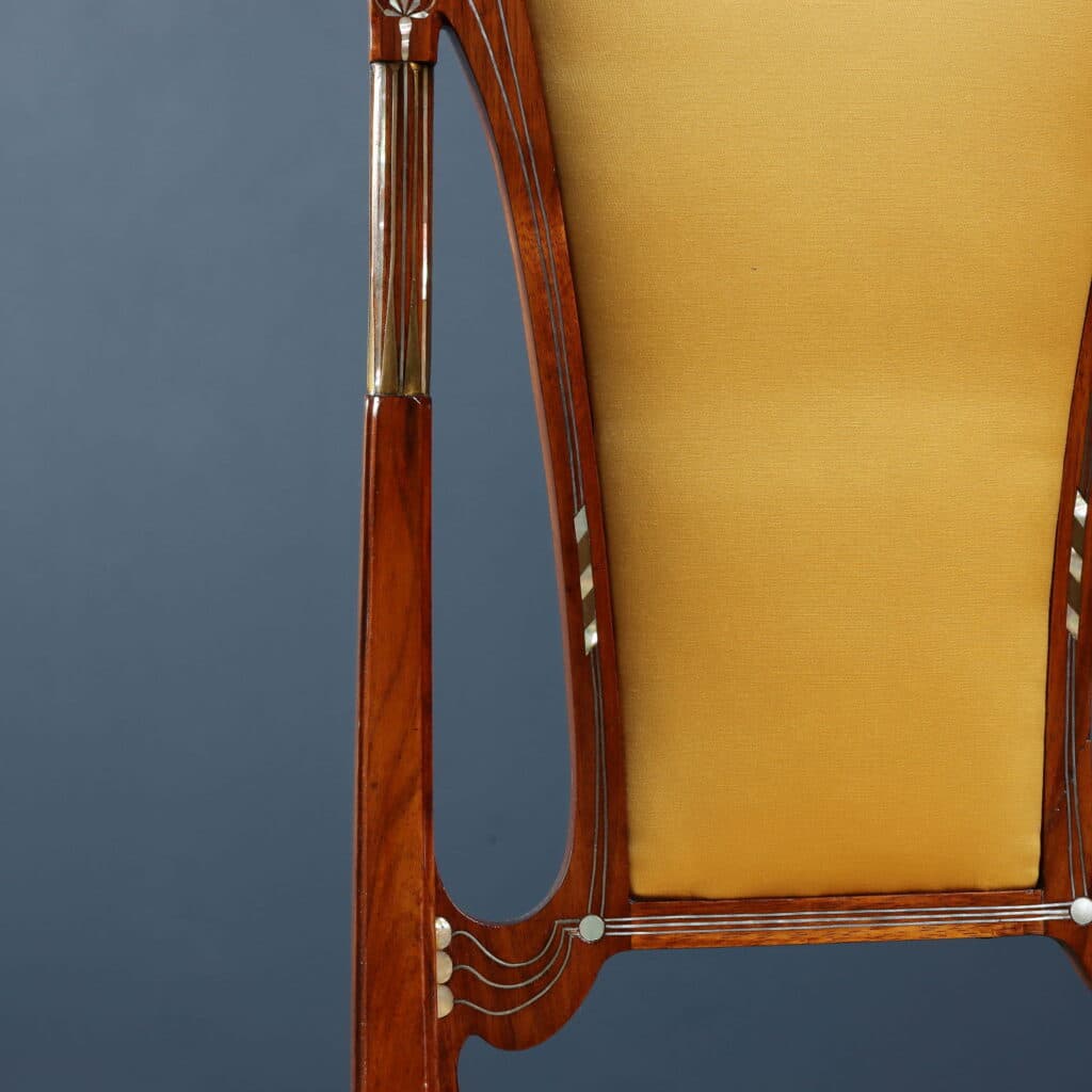 Mahogany writing desk enriched with brass stringing and floral marquetry.