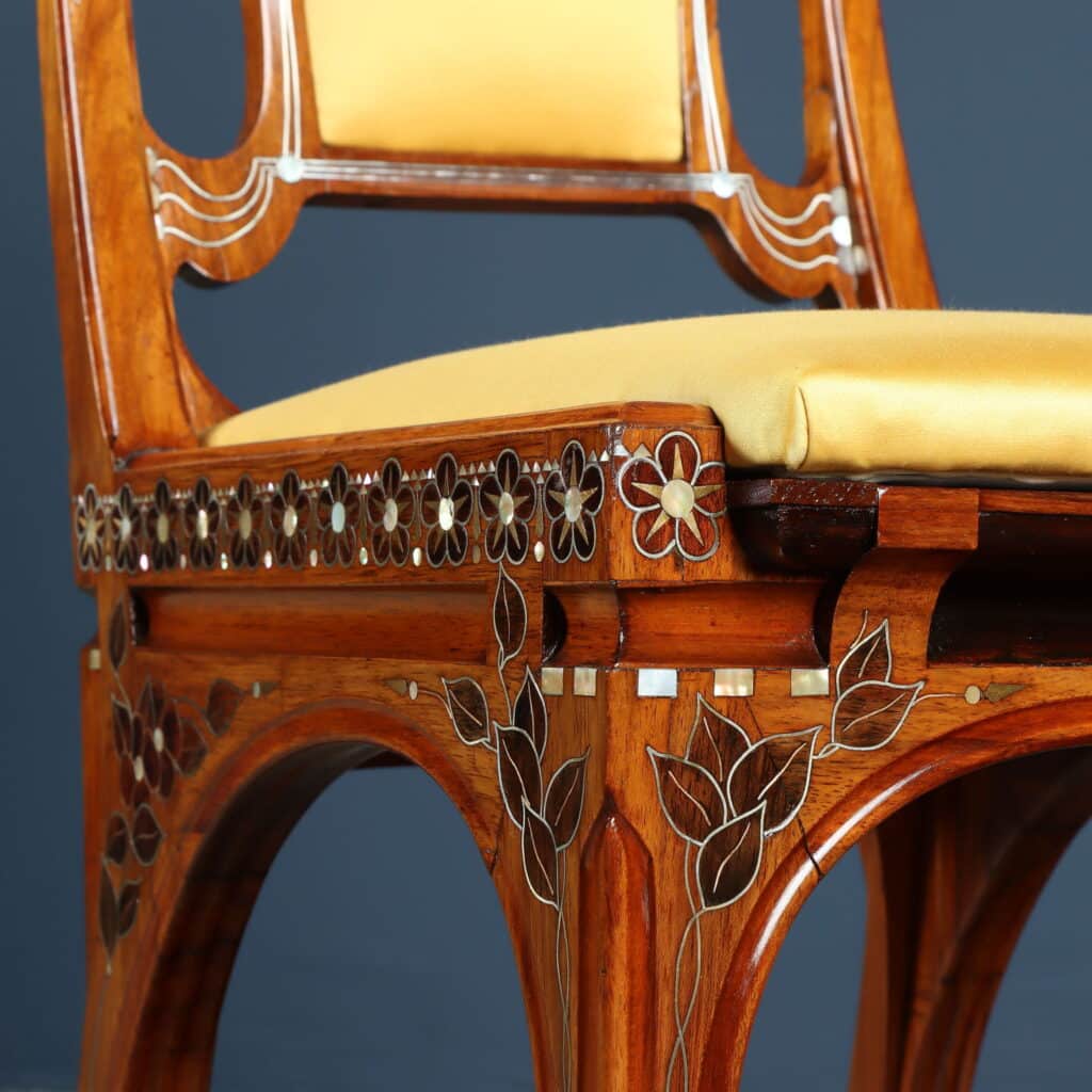 Mahogany writing desk enriched with brass stringing and floral marquetry.