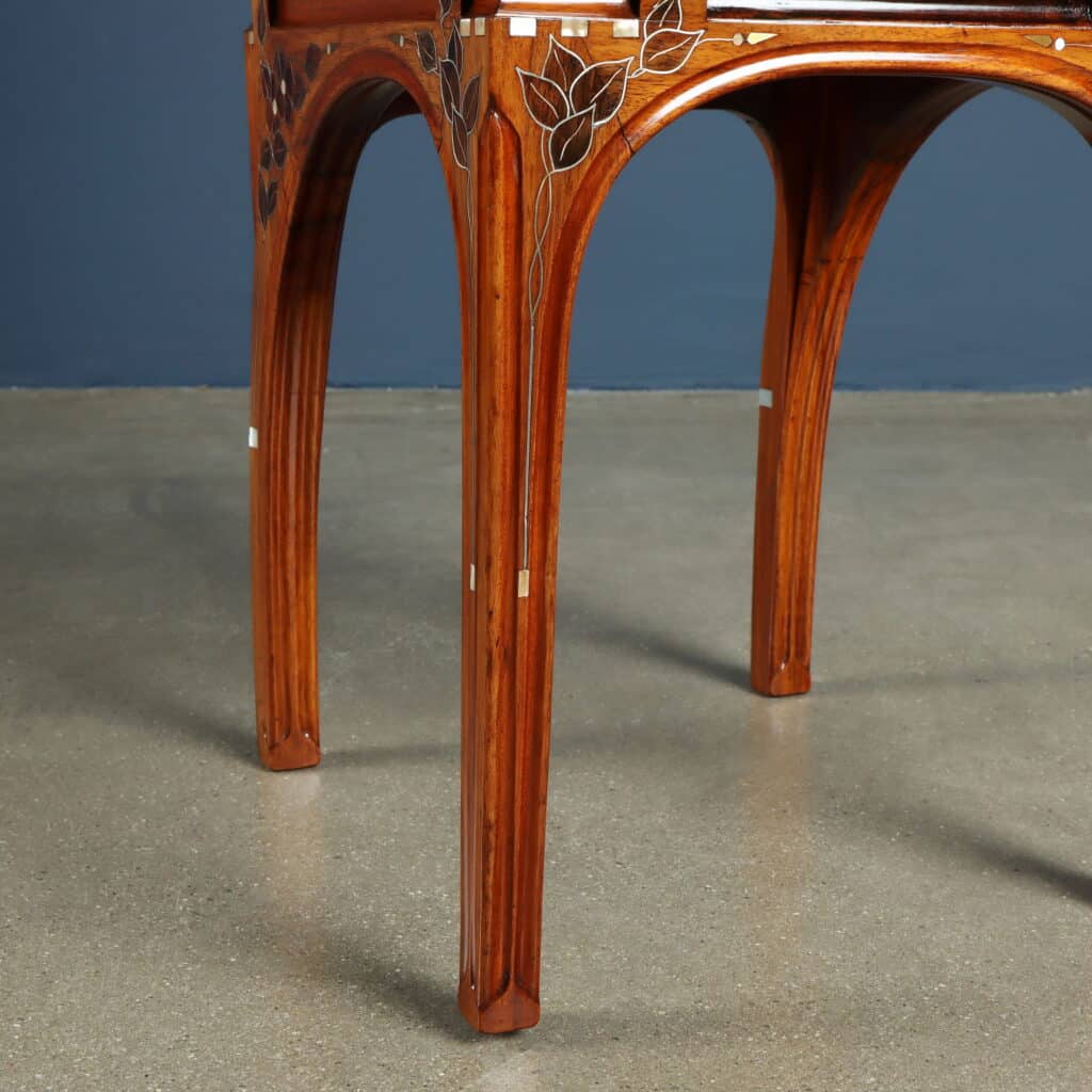 Original chair upholstered in yellow silk with gracefully arched legs.